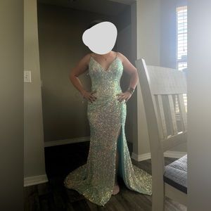 This is a prom dress from a local boutique. It is a size eight and it’s a blue!